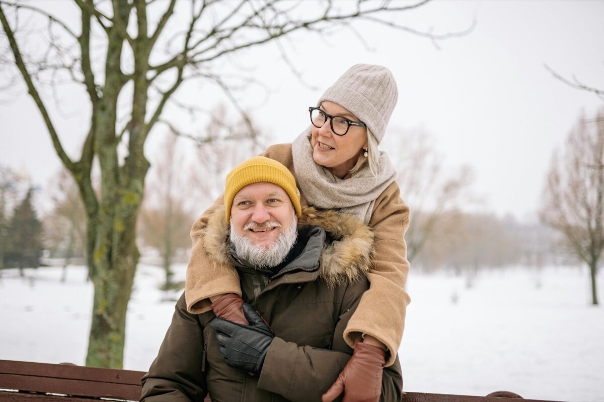 Senior couple reading insurance articles and educational content